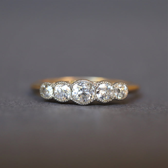 Antique five stone diamond ring. Antique diamond ring. Edwardian diamond ring. Antique diamond engagement ring. Edwardian engagement ring. Millegrain setting. Platinum setting. Old European cut diamond ring. Antique old cut diamond ring. Old cut diamond ring.